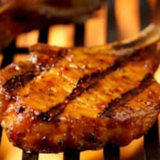 Grilled Pork Chops with Mushrooms Sautéed in Bourbon