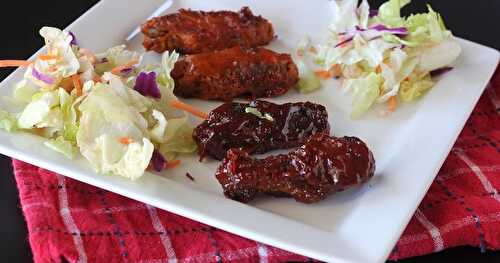 Baked chicken wings and a spiced, sweet and sour sauce 