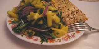 Grilled salmon with Baby Greens, Mango & Marinated Onion