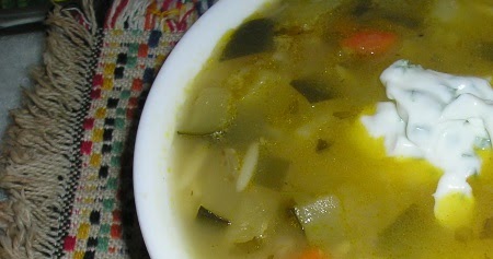 Lemony orzo zucchini soup with jalapeno sour cream sauce
