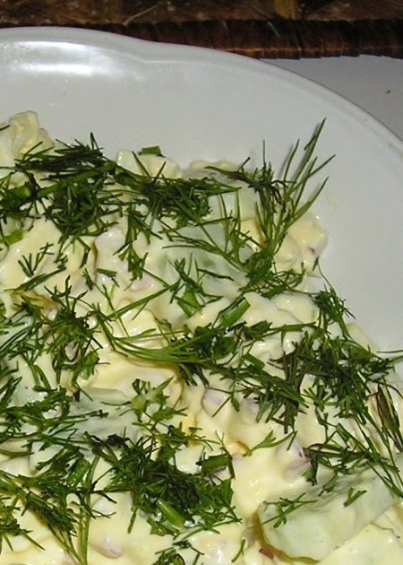 Old-fashioned yiddishe salad with fresh cucumbers and boiled eggs