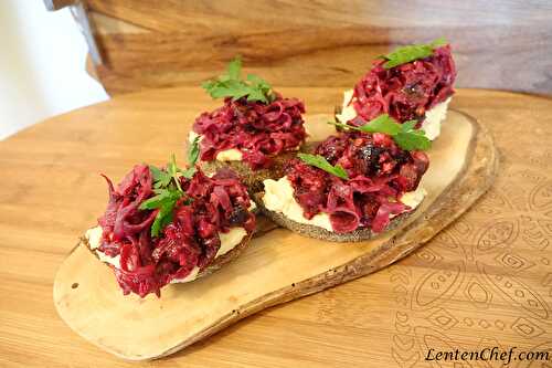 Beet root salad with prunes, walnuts in veg mayo on a bun with hummus