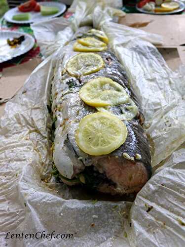 Whole salmon grilled in newspaper