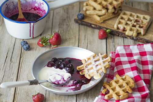 Strawberry waffles with blueberries and yogurt