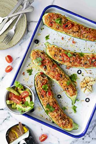 Stuffed zucchini with whole grain rice, pepper, olives and anchovies
