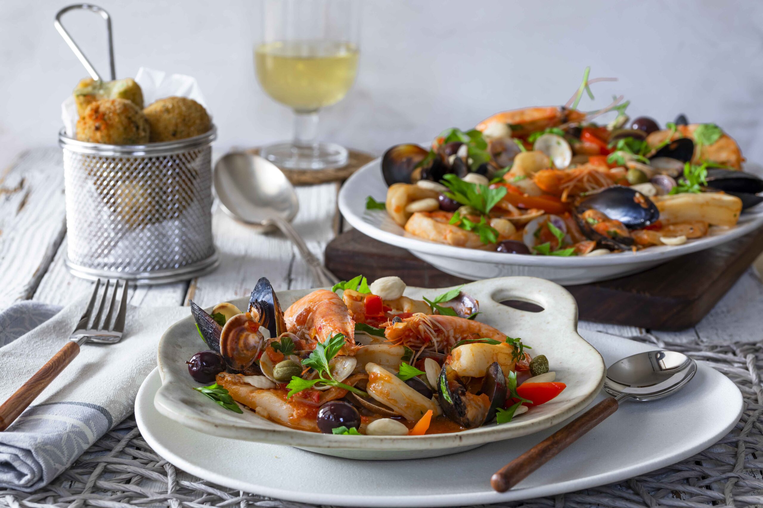 Mediterranean fish dish with spicy potato croquettes