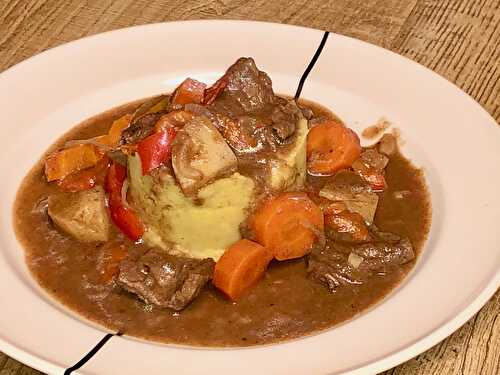 Beef roulade stew with winter vegetables in port