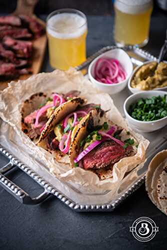Michelada Marinated Steak Tacos with Chipotle Avocado Sauce and Beer Pickled Onions