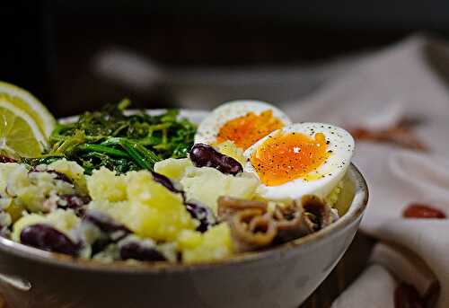 Potato mash with red beans, egg and mustard greens.